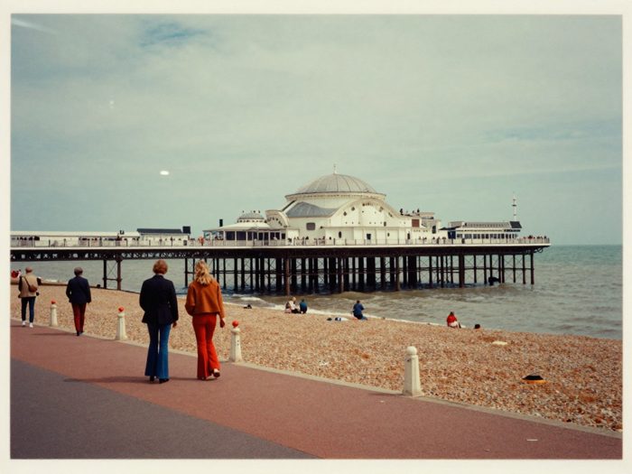 Guest AI work by Z-Image-Turbo: Untitled (faded 1970s colour print). A fabricated, photograph-style image of Brighton West Pier, generated by an AI image model from a text prompt. It is not a real photograph.