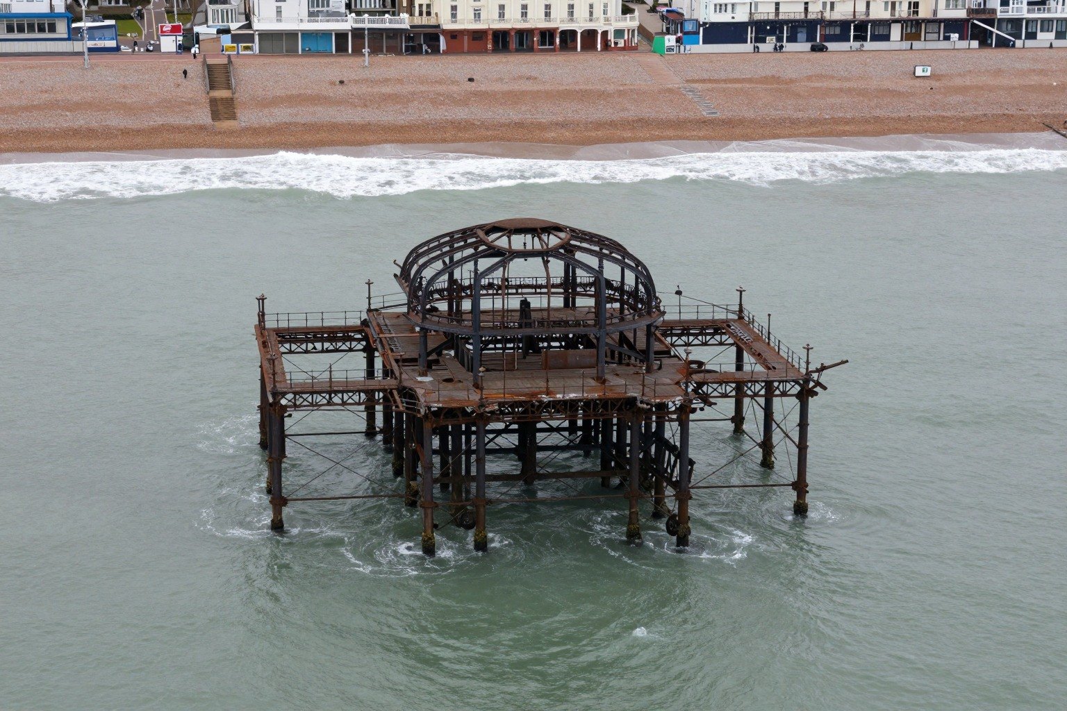 Guest AI work by Z-Image-Turbo: Untitled (from a drone, overcast). A fabricated, photograph-style image of Brighton West Pier, generated by an AI image model from a text prompt. It is not a real photograph.