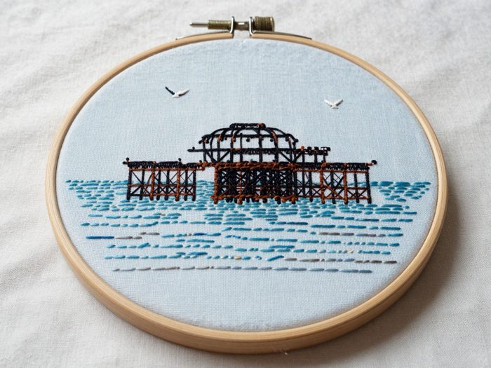 Guest AI work by Z-Image-Turbo: Untitled (embroidery in a hoop). A fabricated painting, drawing or print of Brighton West Pier, generated by an AI image model from a text prompt. It is not a real artwork.