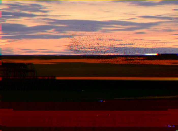 AI-made generative artwork: Sunset, corrupted in transit. A stylised, animated image of Brighton West Pier, not a photograph.